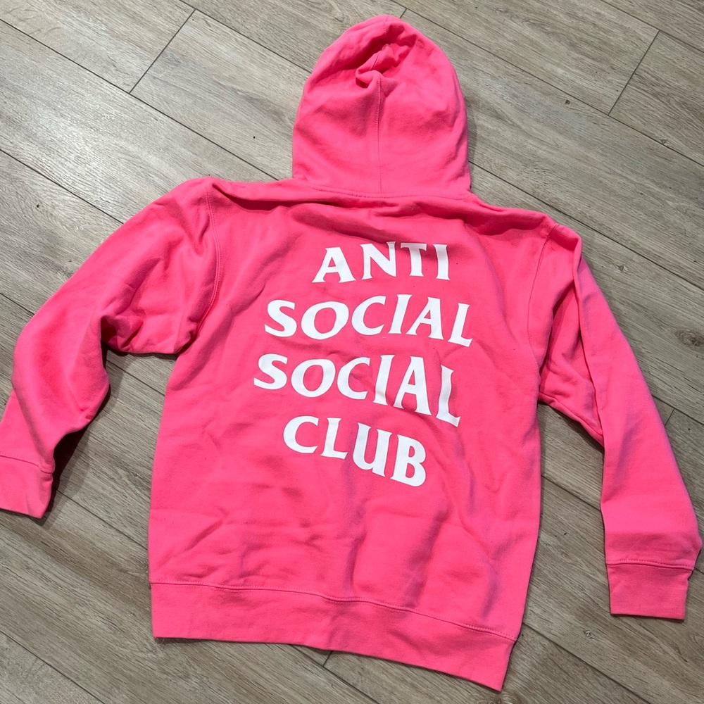 Anti Social Social Club pink and white hoodie.